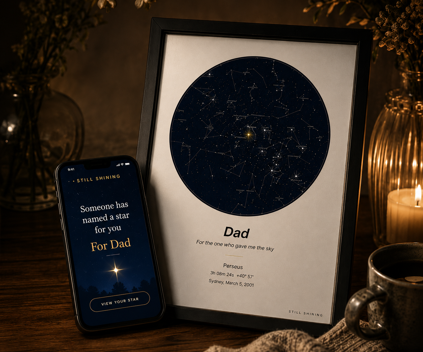 A framed Still Shining star map on a candlelit desk, beside a phone showing the gift reveal