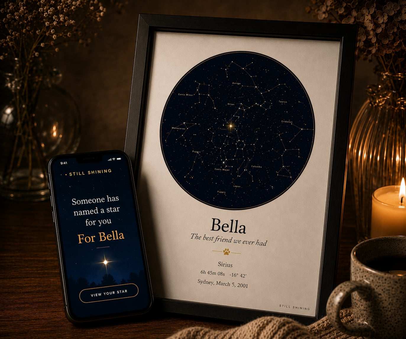A framed Still Shining star map named for Bella, on a candlelit desk beside a phone showing the gift reveal