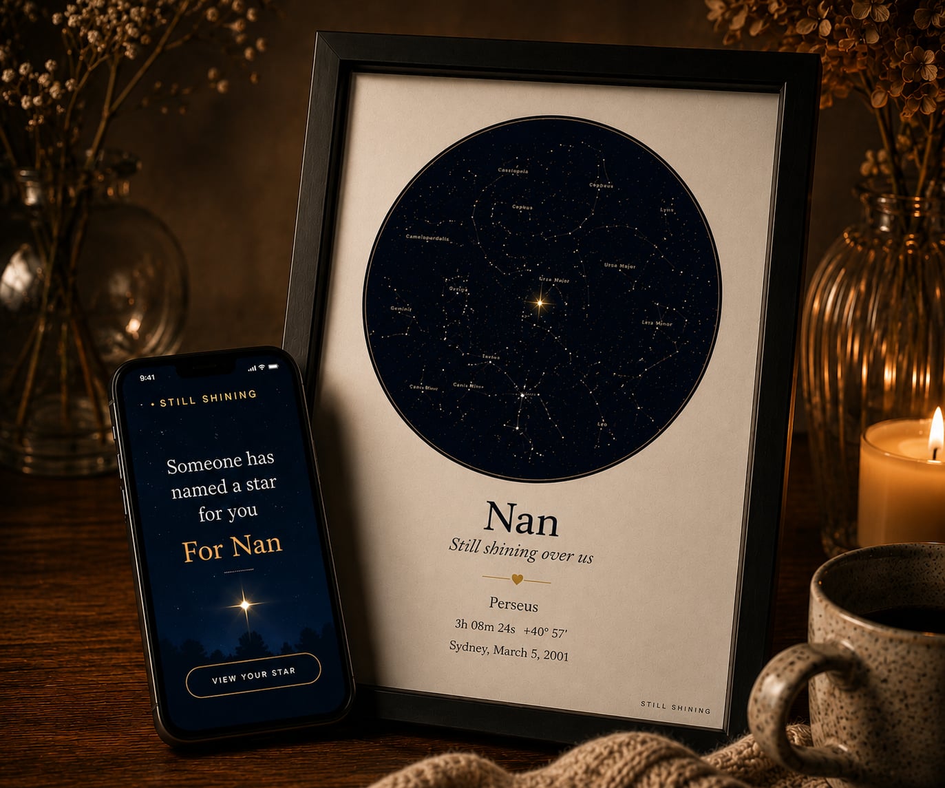 A framed Still Shining star map named for Nan, on a candlelit desk beside a phone showing the gift reveal